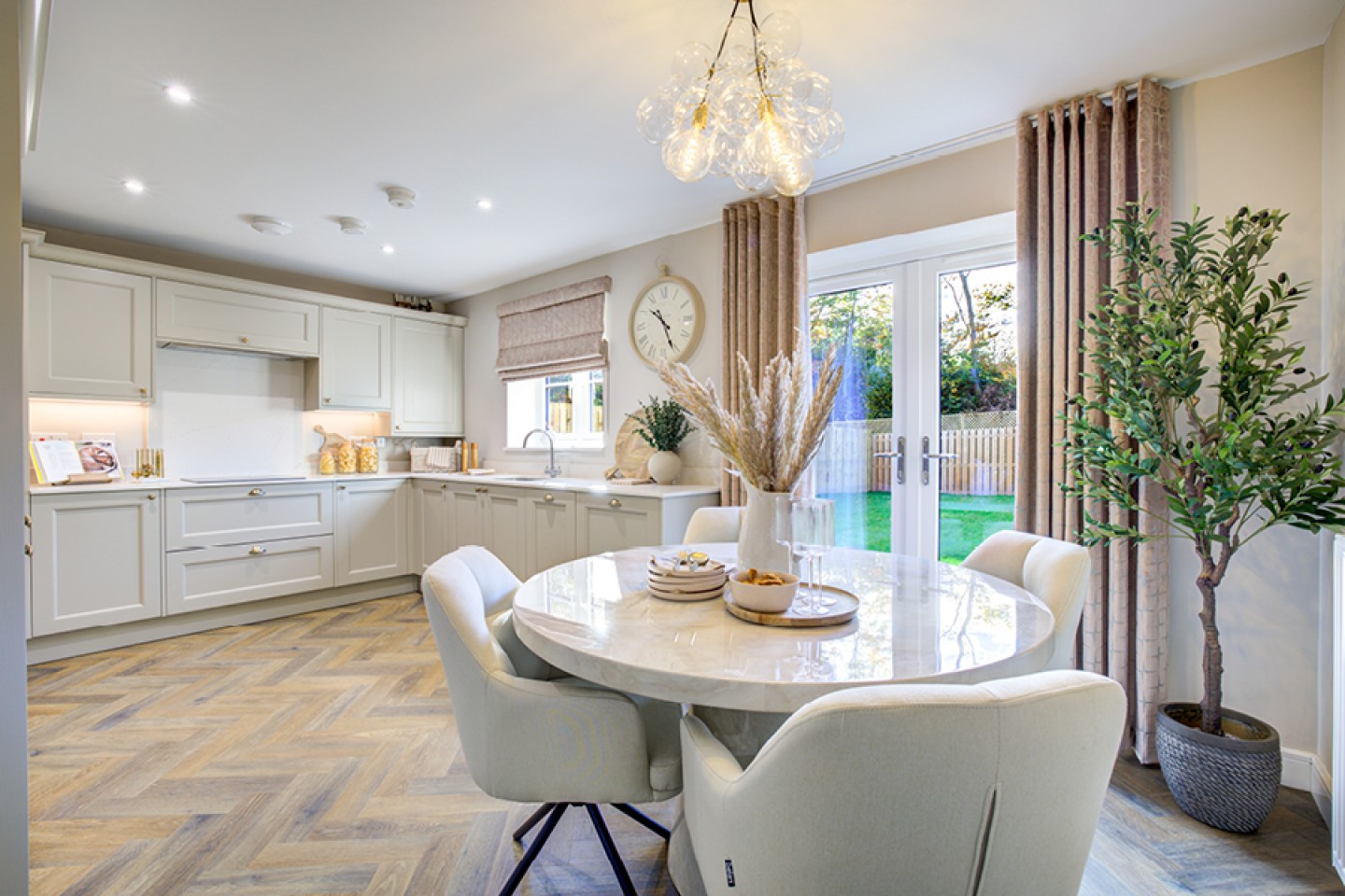 Modern kitchen diner with patio doors leaning to garden